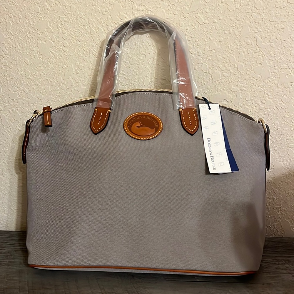 Brand new Dooney and Bourke never used still in the plastic